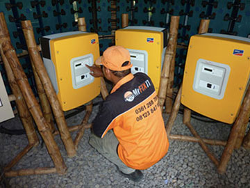 Bali electrician installing a solar voltaic system